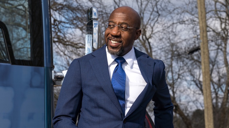  Georgia Democratic Candidate Rev. Raphael Warnock meets with supporters on January 5, 2021 in Marietta, Georgia. Polls have opened across Georgia in the two runoff elections, pitting incumbents Sen. David Perdue (R-GA) and Sen. Kelly Loeffler (R-GA) against Democratic candidates Rev. Raphael Warnock and Jon Ossoff. (Photo by Megan Varner/Getty Images)