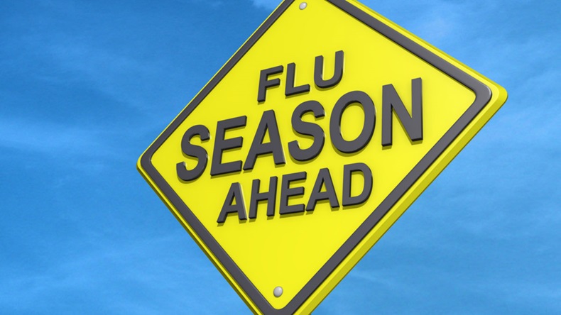 A yield road sign with Flu Season Ahead
