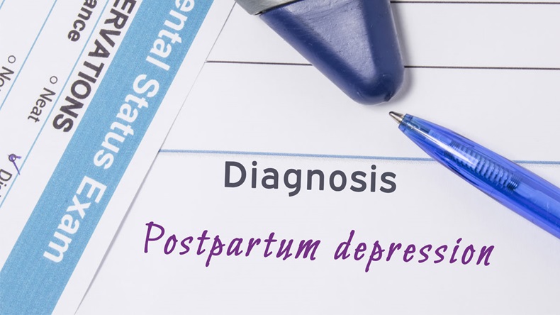 Psychiatric diagnosis Postpartum Depression. On psychiatrist workplace is medical certificate which indicated diagnosis of Postpartum Depression surrounded of questionnaire mental exam and hammer