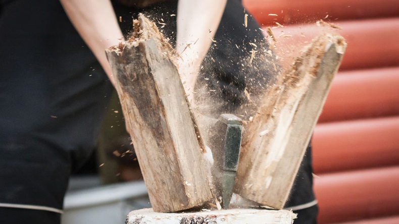 Wood chopping with hand axe 