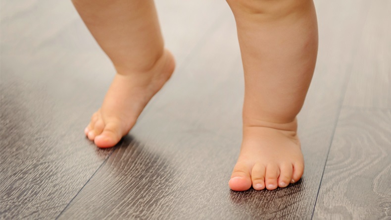 Baby legs. charming small legs doing the first steps - Image 