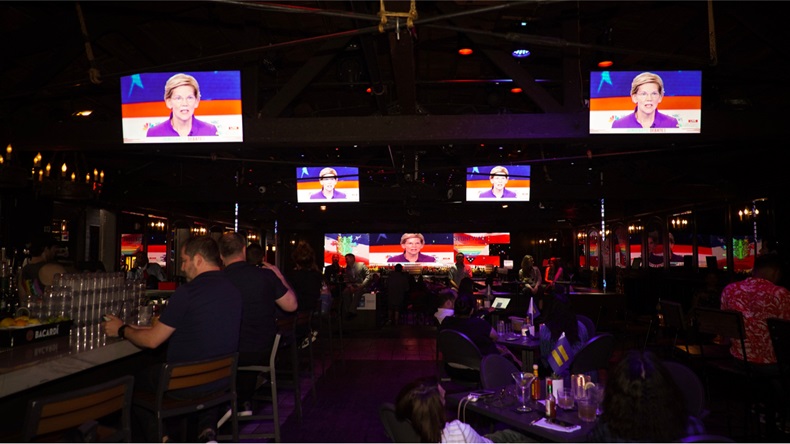 Democratic debate watch party at the abbey in West Hollywood California June 26, 2019. Senator Elizabeth Warren on the TV screens debating. Election 2020 - Image 