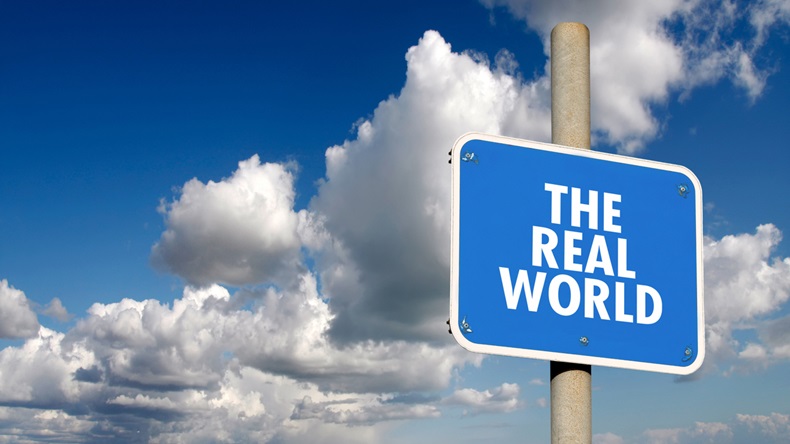 The real world signpost with blue sky and clouds