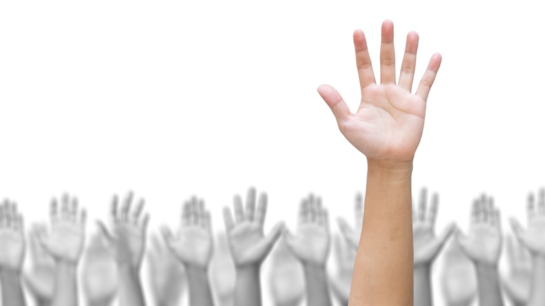 Business crowd raising hands high up on white background. Concept Business / Question / Ask / Idea. 