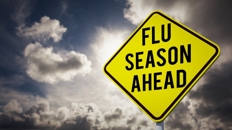 flu season ahead against dark sky with white clouds