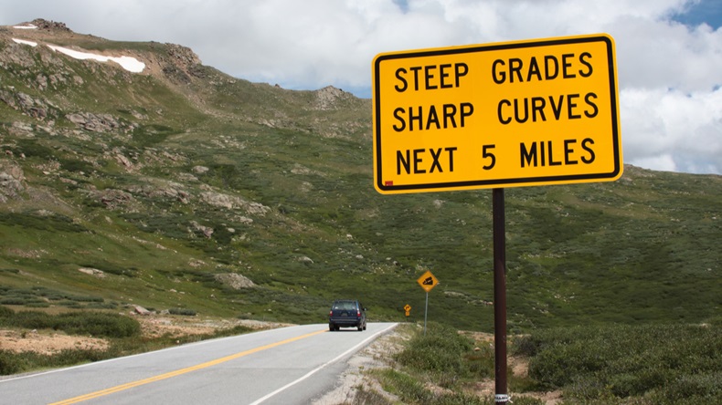 Steep grades and curves, road sign, dangerous road