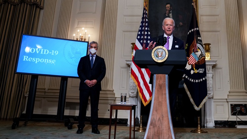 WASHINGTON, DC - JANUARY 26: U.S. President Joe Biden speaks about the coronavirus pandemic in the State Dining Room of the White House on January 26, 2021 in Washington, DC. Also pictured at left is Jeffrey Zients, head of the Biden administration's COVID-19 task force. President Biden said his administration has secured commitments from vaccine makers Pfizer and Moderna to purchase another 200 million doses that will arrive this summer. (Photo by Doug Mills-Pool/Getty Images)