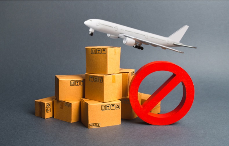 Cargo plane, many boxes and red prohibition symbol NO.