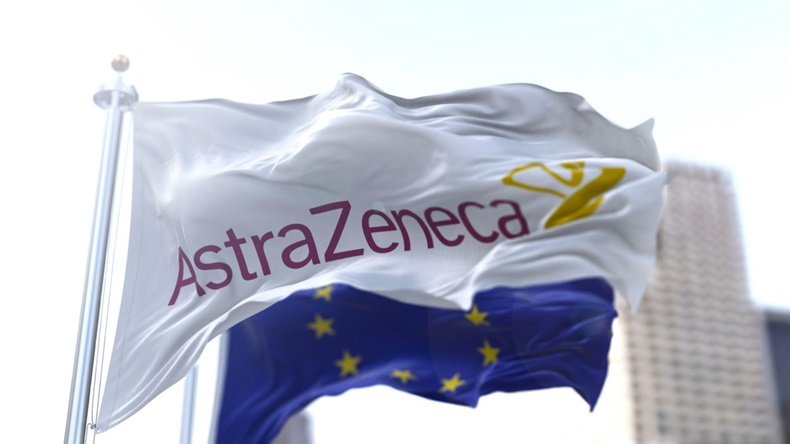 White flag with the Astrazeneca logo waving in the wind with the European flag in the background