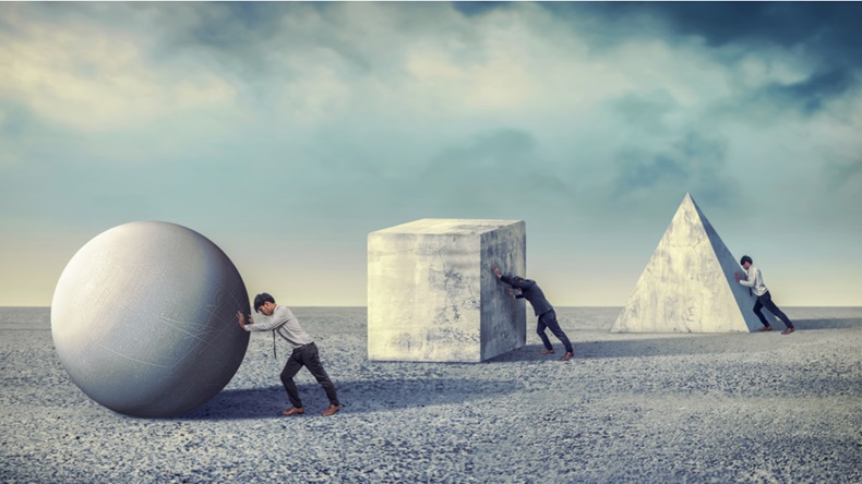 Businessman pushing the round large stone. Business heavy tasks and problems concept. differentiation between work