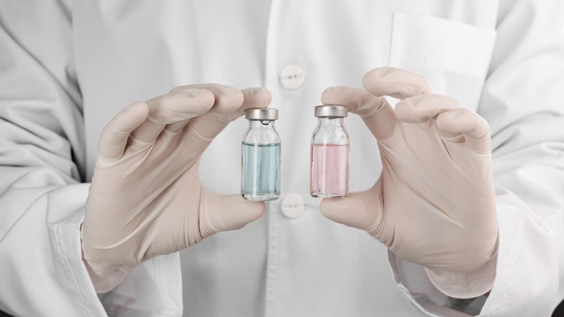 Doctor holding two vials