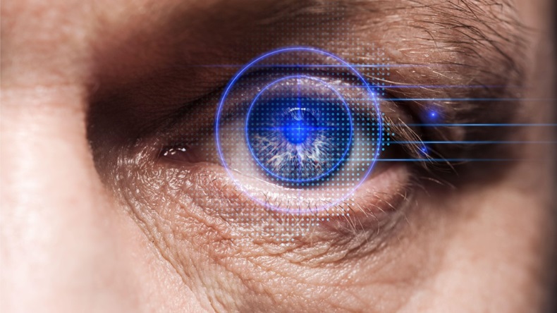  Share   close up view of human eye with data illustration, robotic concept