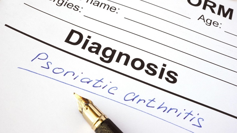 Medical form with diagnosis psoriatic arthritis on a table