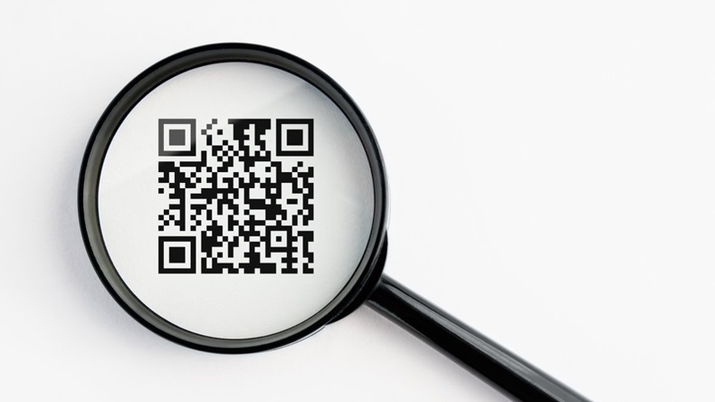 qr-code under a magnifying glass, with isolated background