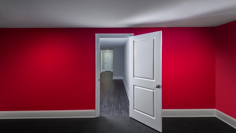 white open door red walls