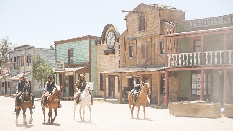 Gang of cowboys riding horses on wild west film set, Fort Bravo, Tabernas, Almeria, Spain - Image ID: EY250G (Alamy)