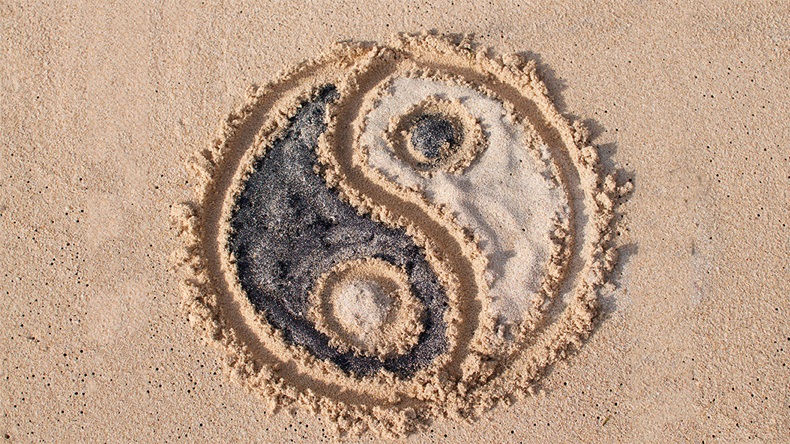 yin yang in sand
