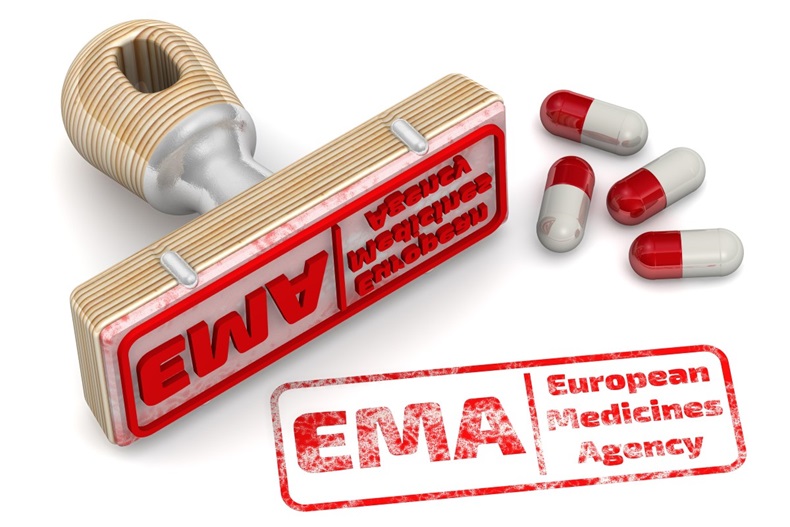 Red stamp and an imprint EMA (European Medicines Agency) on white surface. EMA is an agency of the EU in charge of the evaluation and supervision