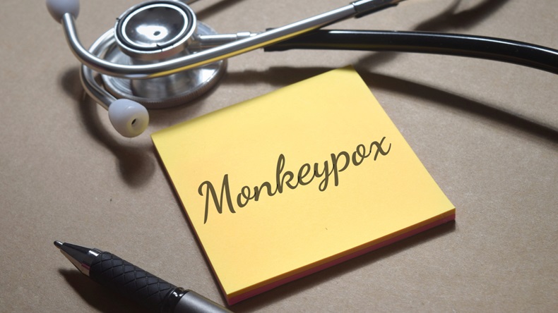 Top view image of pen and stethoscope with Monkeypox wording. Medical concept