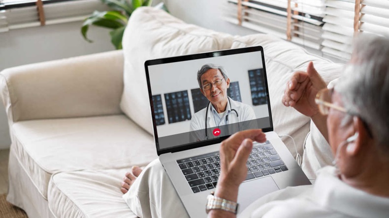 Asian senior in video call with doctor. Telemedicine telehealth concept