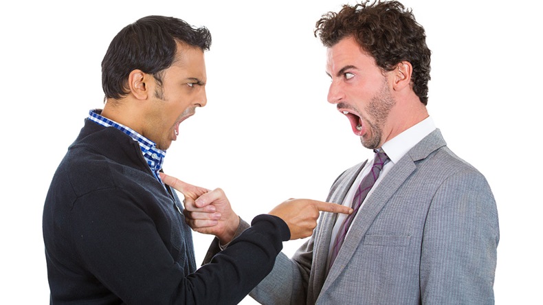 Closeup portrait, two angry men pointing fingers at each other blaming for problems, isolated white background. Interpersonal conflict. Negative human emotions facial expression feeling, body language