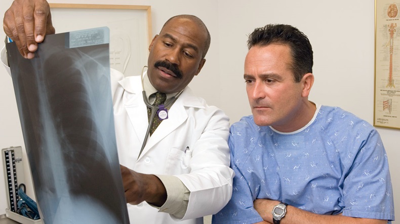 Doctor and patient examining xray results