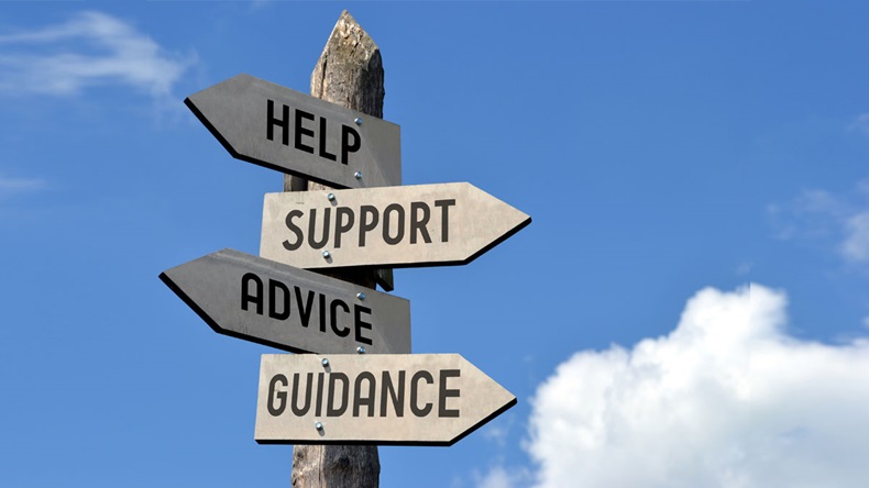Wooden signpost with four arrows - "help, support, advice, guidance". Great for topics like customer support, assistance, business presentations etc. 