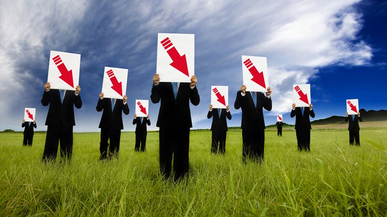 group of businessman in black suit and holding red arrow down graph