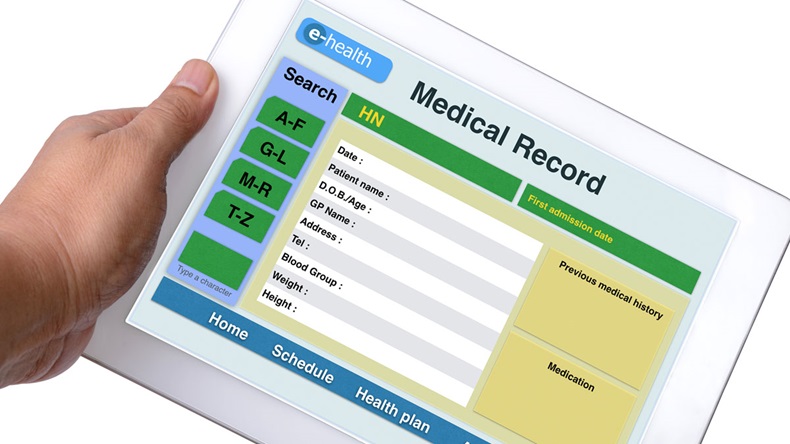 Patient medical record browse on tablet in someone hand on white background.
