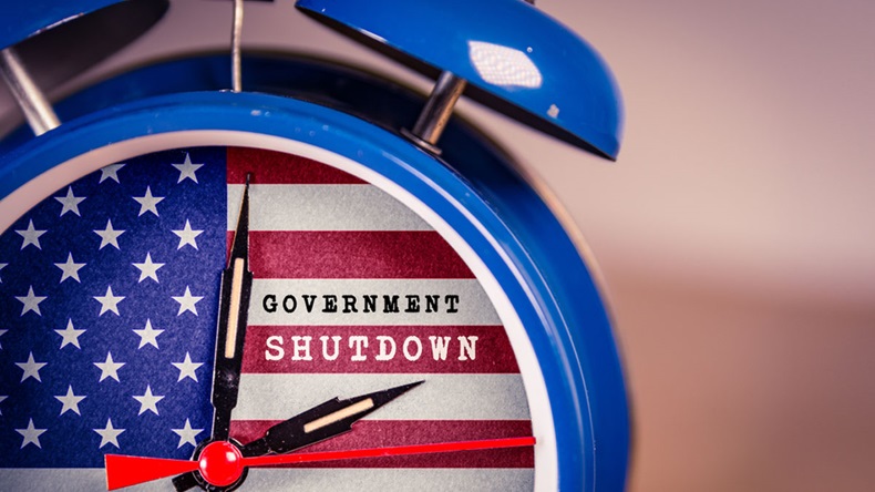 Retro alarm Clock with Government Shutdown text,and American Flag. USA shutdown, government closed and American federal shut down due to spending bill disagreement between the left and the right - Image