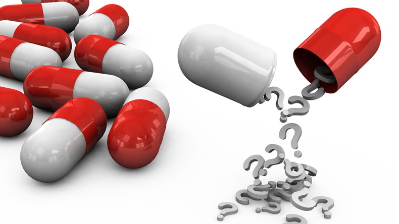 3d different tablets and pills on a white background with question marks