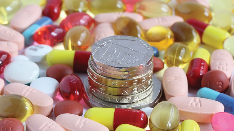 money coins surrounded by pills tablets and capsules