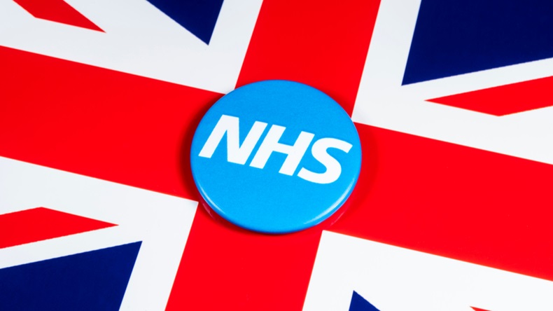 LONDON, UK - APRIL 27TH 2018: The National Health Service symbol over the UK flag, on 27th April 2018. The NHS was established in 1948 as one of the major social reforms following the 2nd World War. - Image 